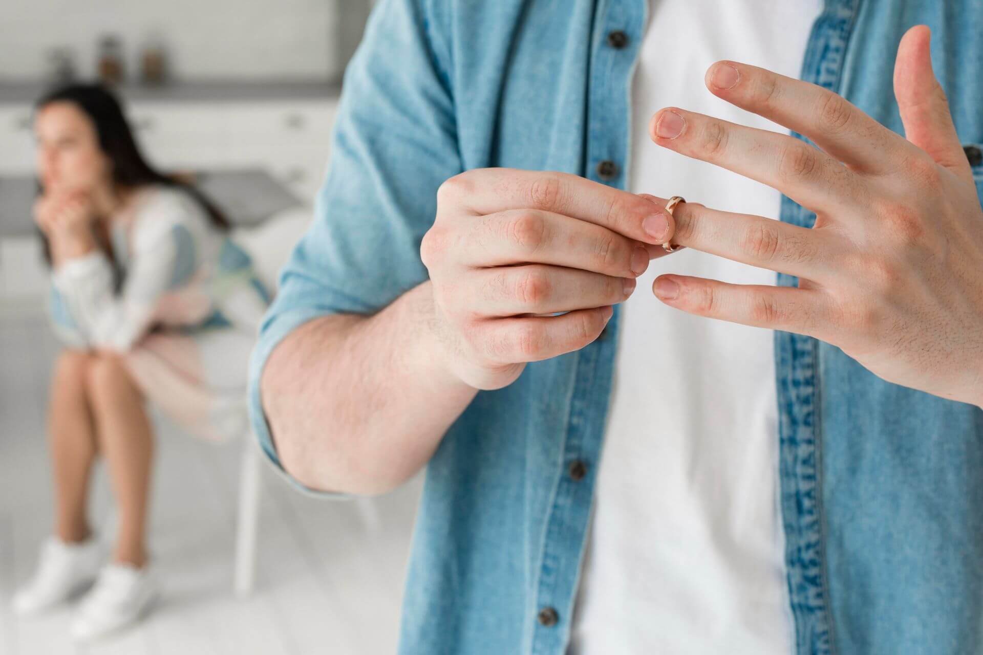 close-up-father-taking-wedding-ring-off