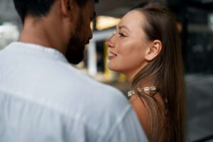 side-view-smiley-couple-public-intimacy