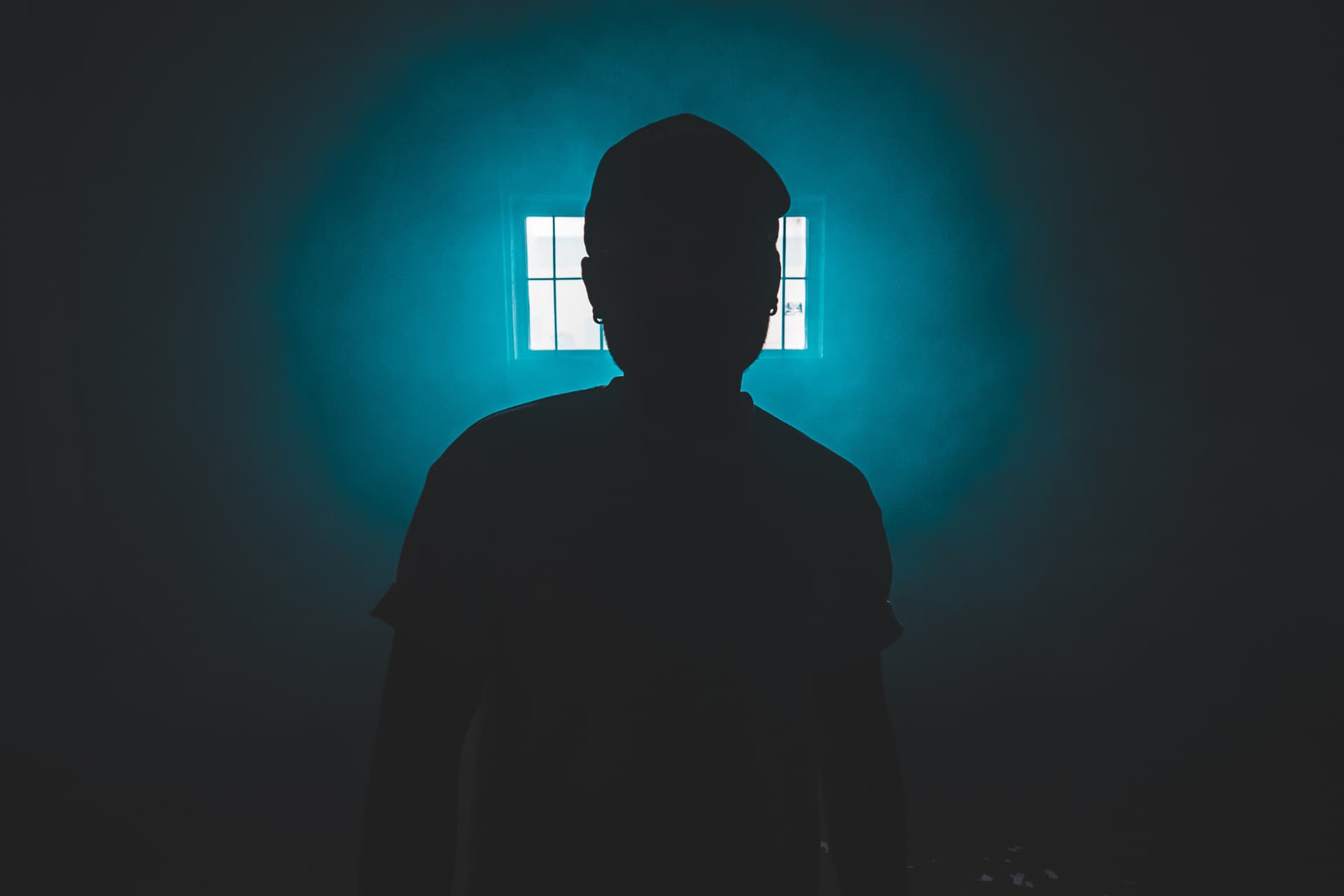 silhouette-standing-person-dark-room