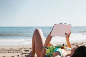 woman-reading-book-beach
