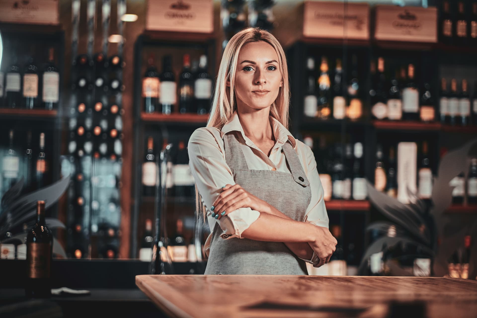 attractive-pensive-woman-uniform-is-waiting-customers-her-wine-restaurant