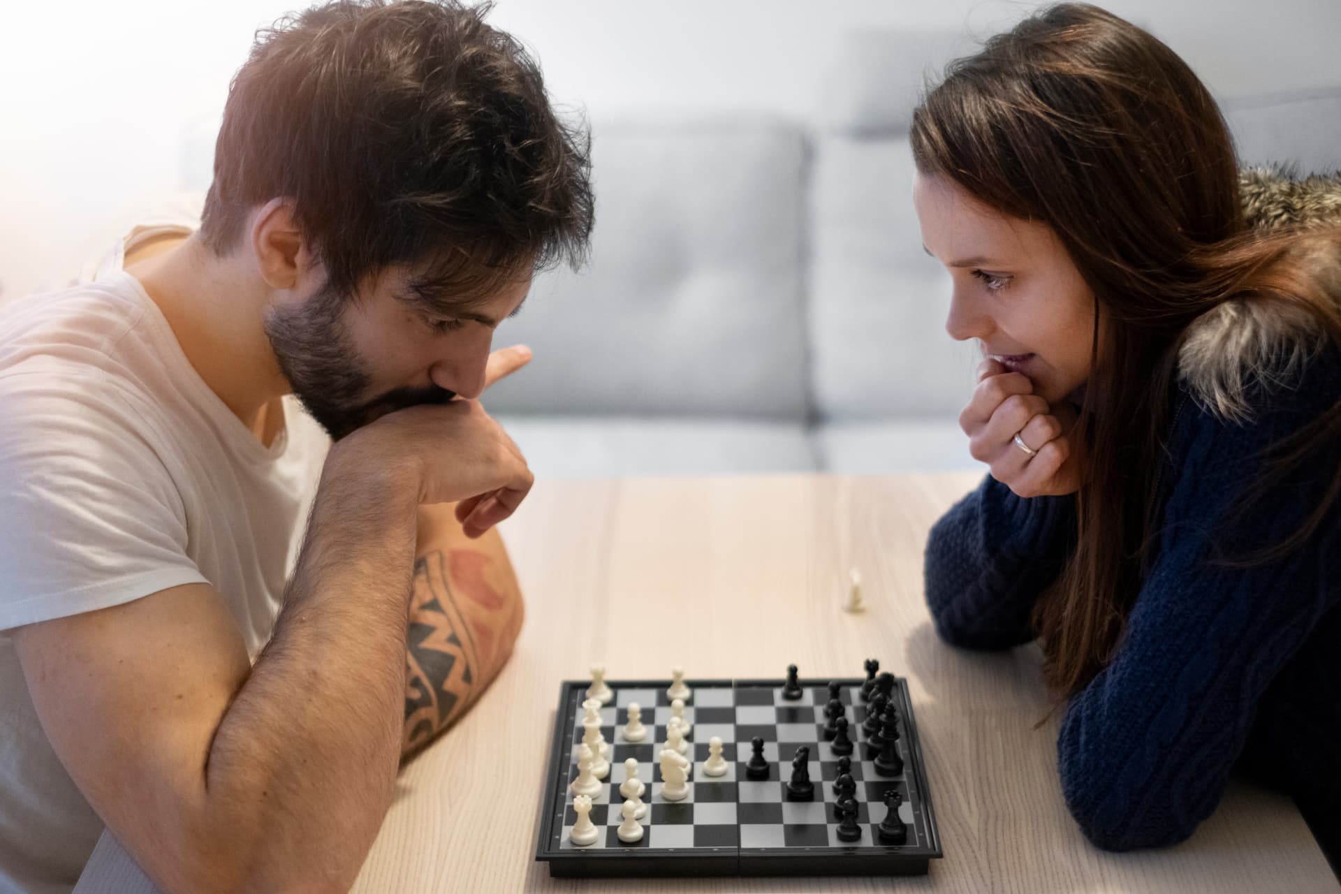 medium-shot-couple-playing-chess
